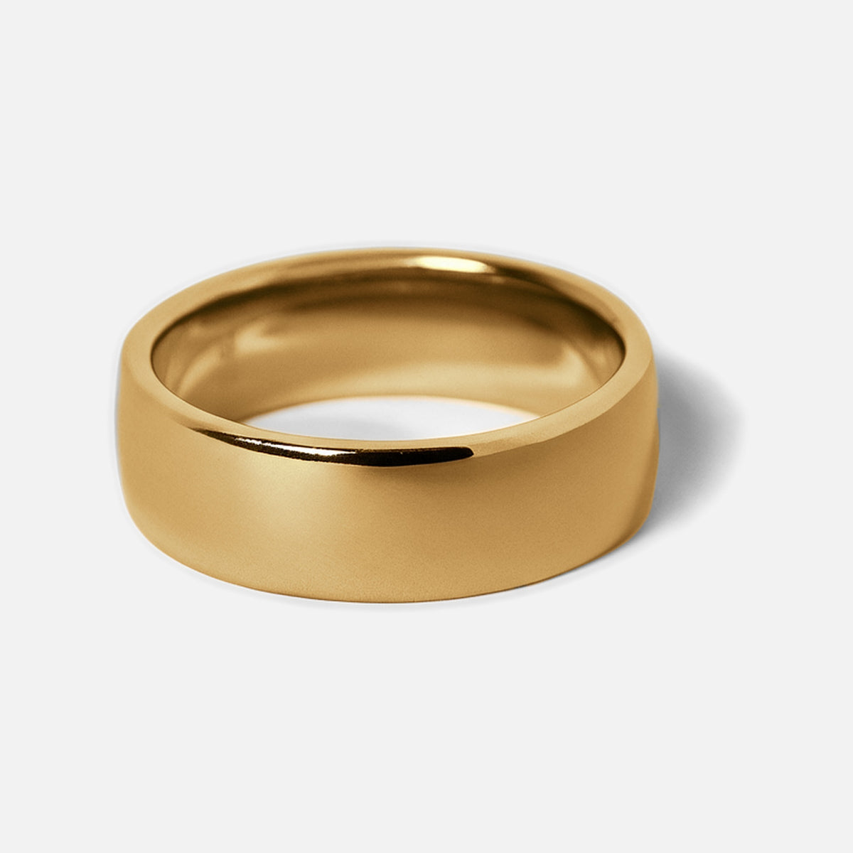 Men's Gold Canvas Ring in 18k gold infused stainless steel, angled view of the wide domed band on a white background