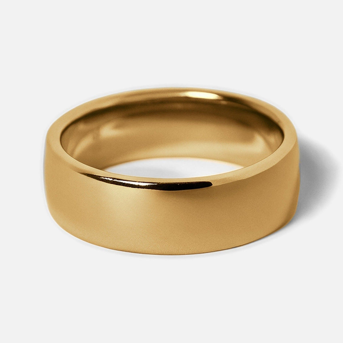 Men's Gold Canvas Ring in 18k gold infused stainless steel, angled view of the wide domed band on a white background