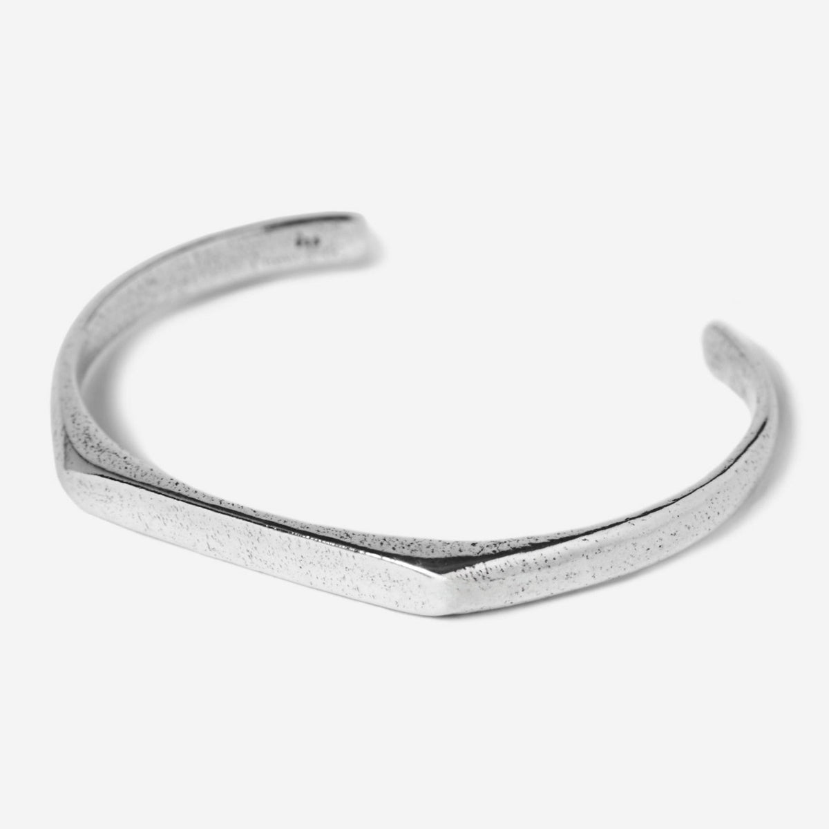 The Billie Jo Echo Cuff in 925 sterling silver, featuring a modern, minimalist design with a flat, textured top bar and a smooth, polished band. A timeless piece of Australian men's jewellery.