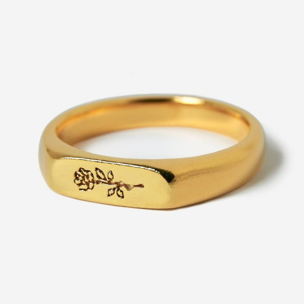 A detailed studio shot of the Billie Jo Rosa II Ring in 18k gold vermeil, featuring a delicate rose engraving on its flat signet-style face.