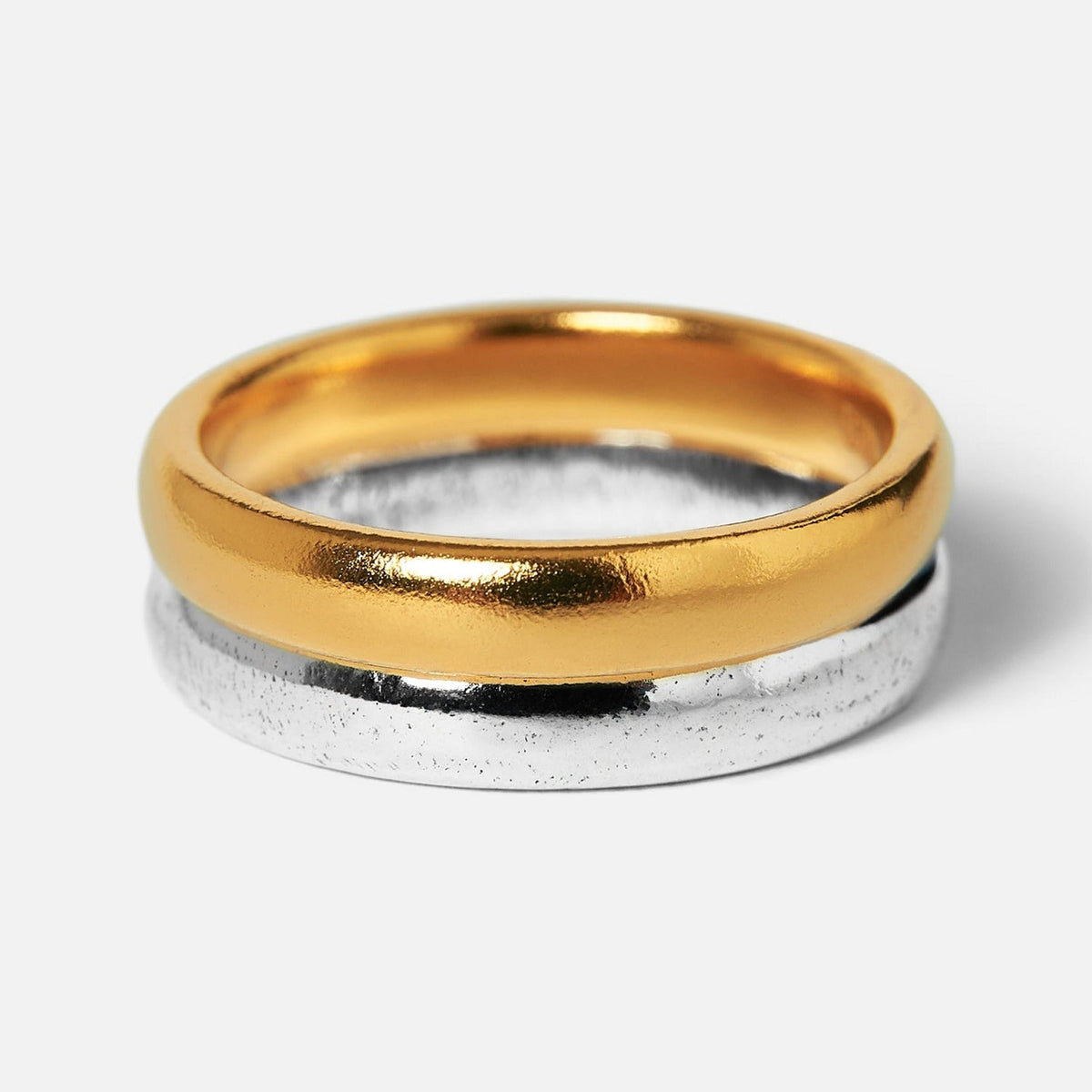 Billie Jo's 'Stackers - Silver & Gold' set. Two minimalist stacking rings in 18k gold vermeil and 925 sterling silver on a white background.