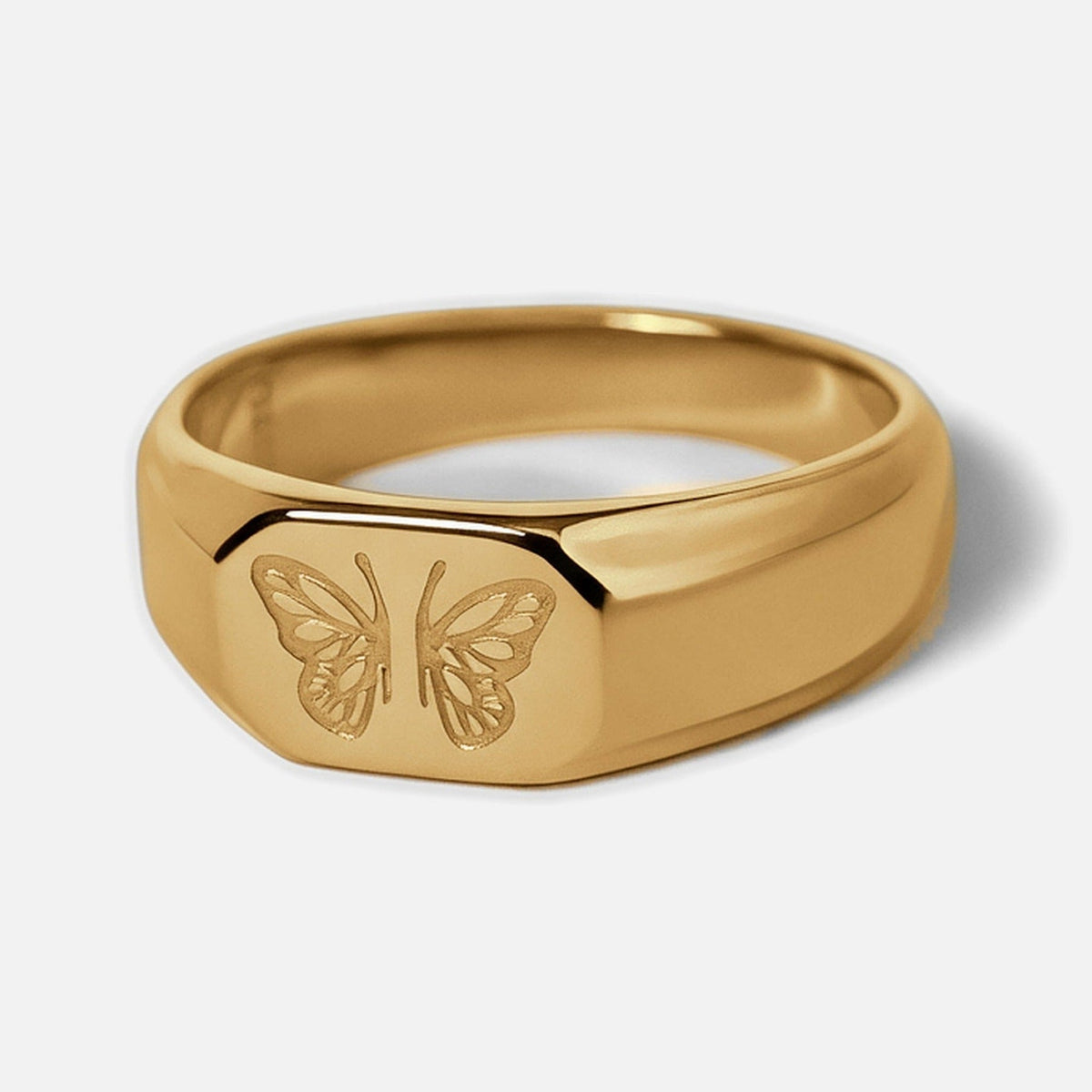 Men's Gold Revival Ring in 18k gold infused stainless steel, front angle showing the engraved butterfly, white background