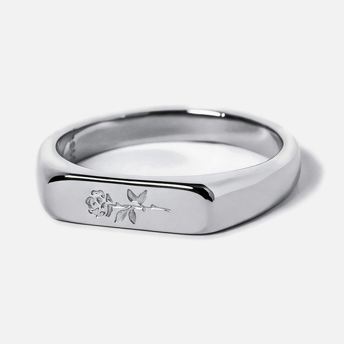 Men's Rosa I Ring in 316L stainless steel, silver finish, single bar ring, rose engraved on the face, white background