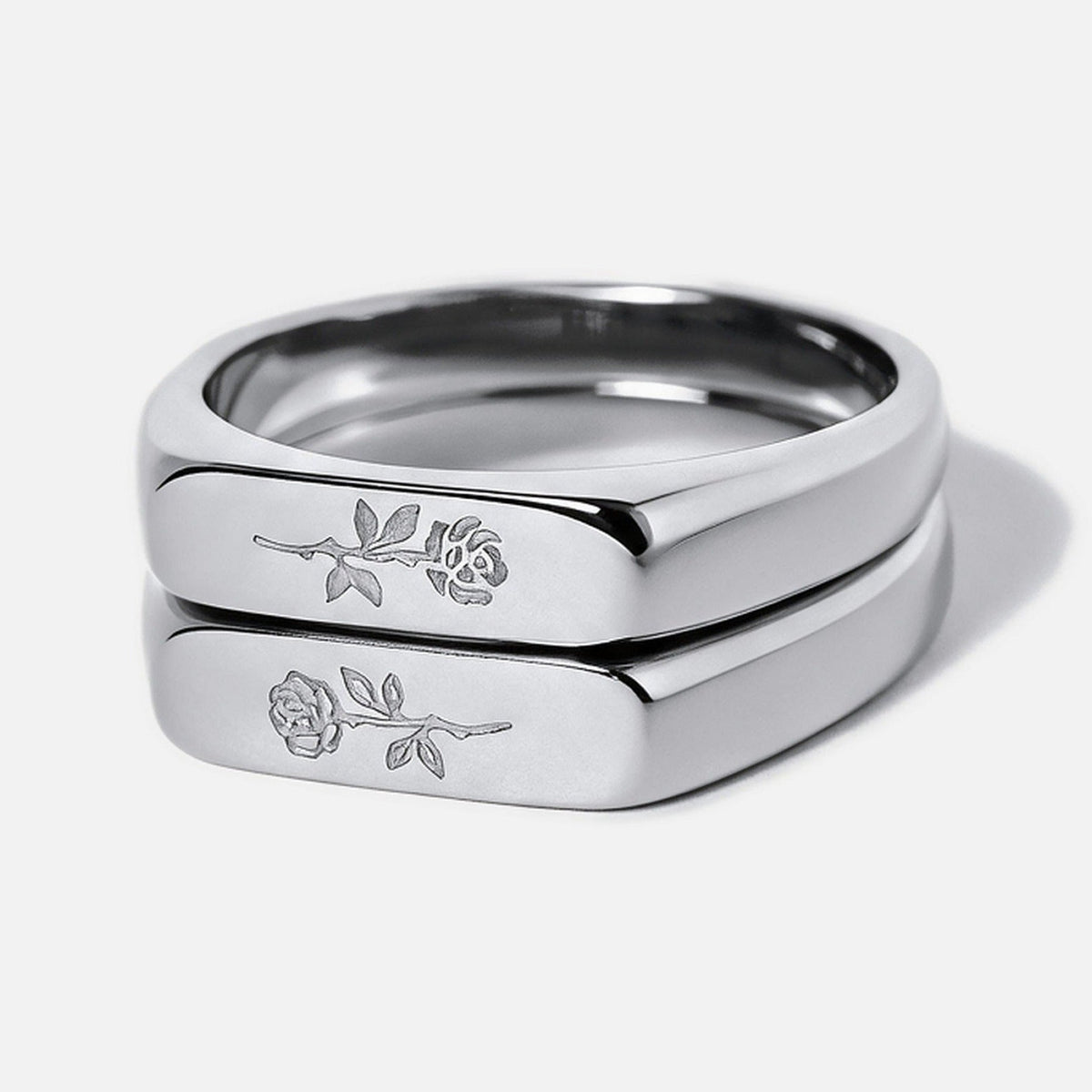 Men's Rosa Stackers in 316L stainless steel, silver finish, pair stacked, light and dark rose engraved, white background
