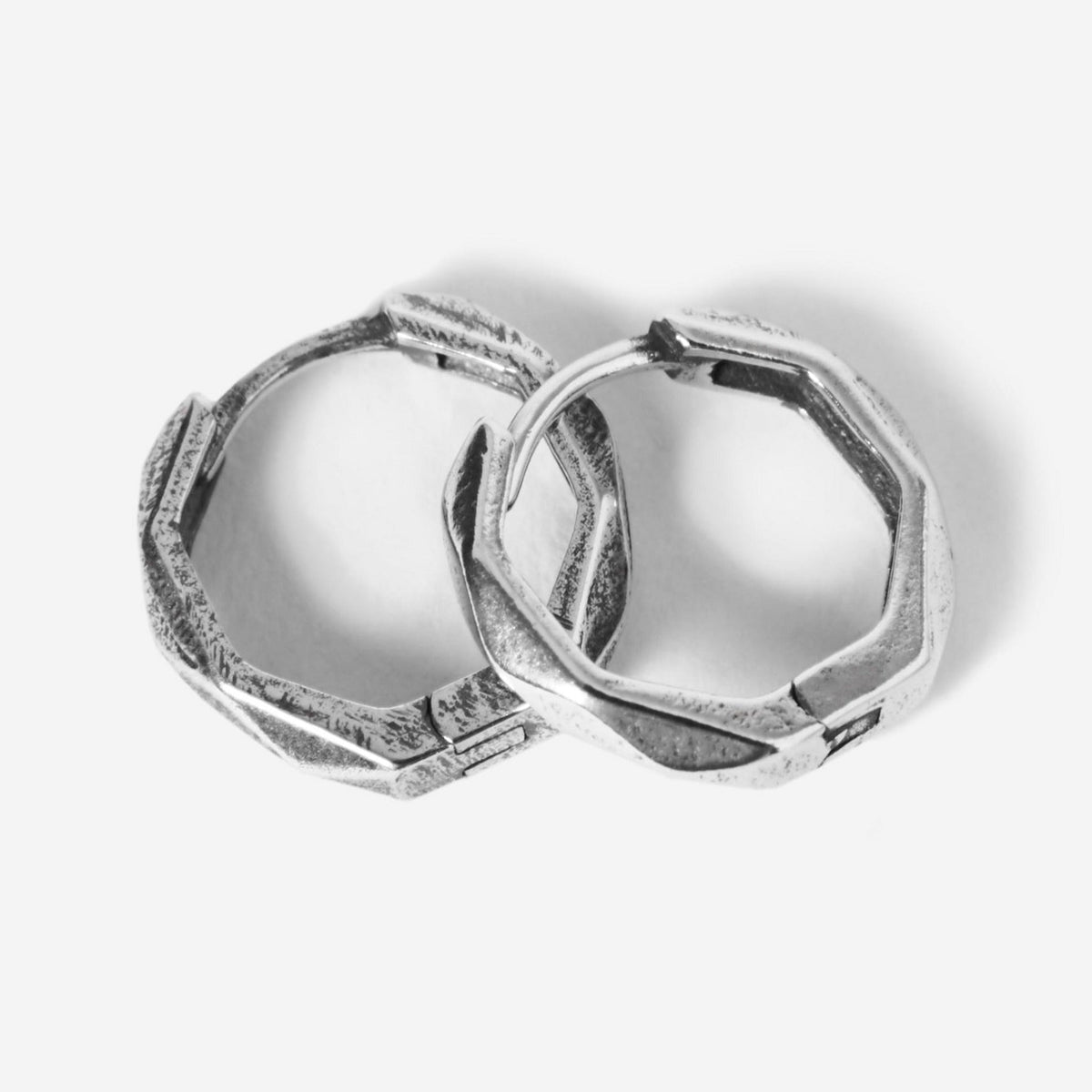 A pair of sterling silver Carve Earrings from Billie Jo, featuring a unique, hand-carved geometric design for a modern, masculine look. Australian men's jewellery.