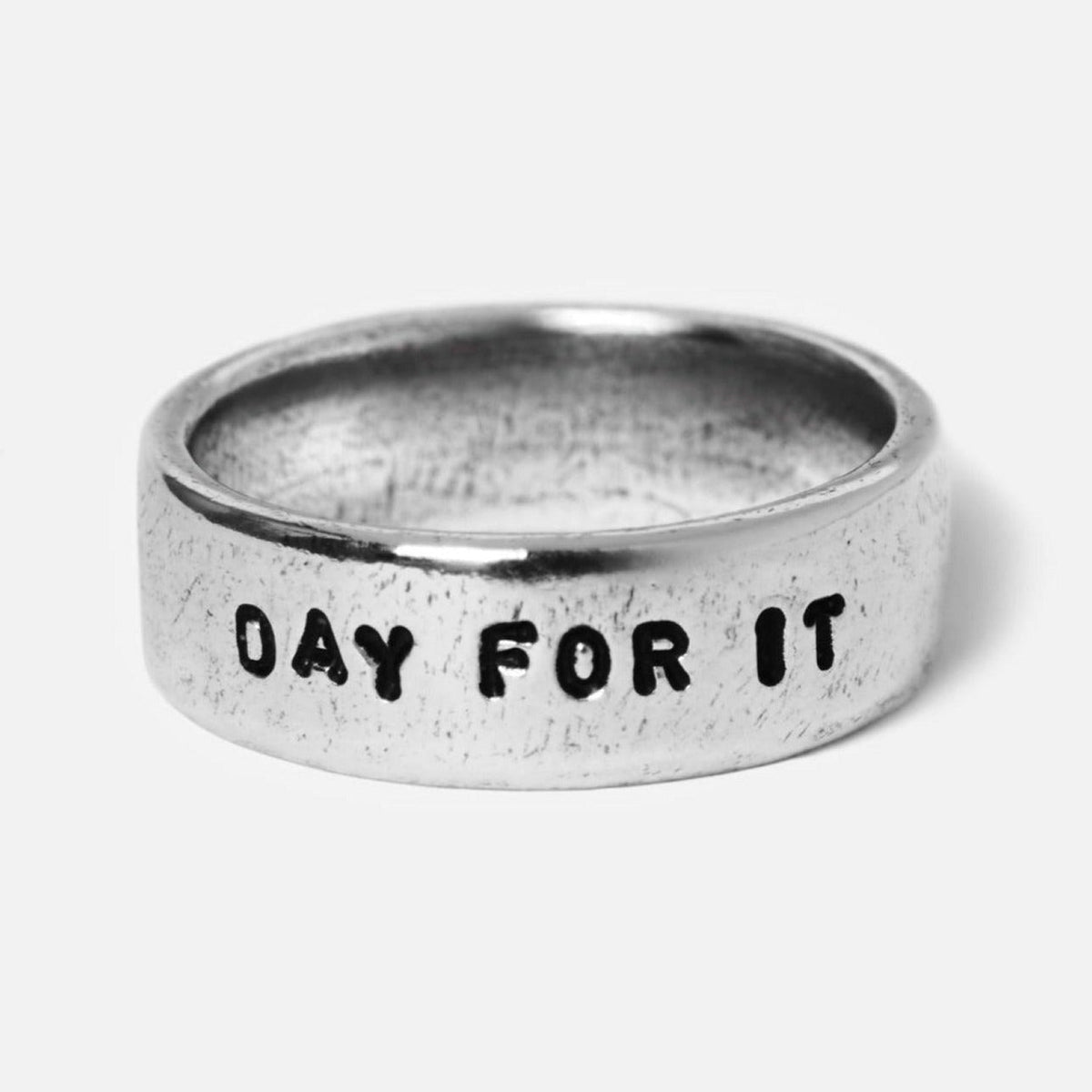 Detail shot of the sterling silver Custom Stamped Ring by Australian men's jewellery brand Billie Jo, with the phrase '''DAY FOR IT''' stamped on it.