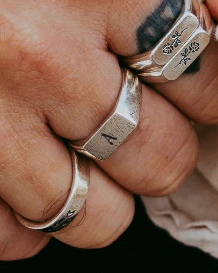 Initial Genesis Ring with the letter A, worn on a man's hand