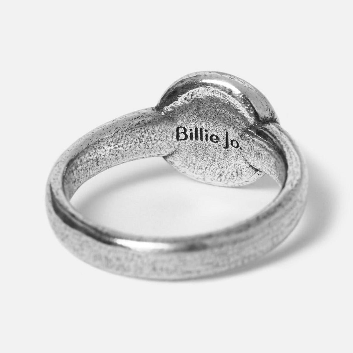 A close-up shot of the back of the Oracle ring, showing the Billie Jo brand name engraved on the inside of the band. This highlights the brand\s attention to detail and authenticity.