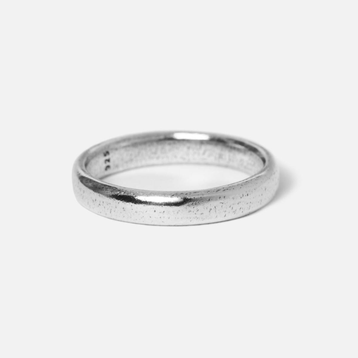 A detailed product shot of a single Billie Jo Stacker Ring in sterling silver, showcasing its rustic, textured finish and minimalist design against a clean white background.