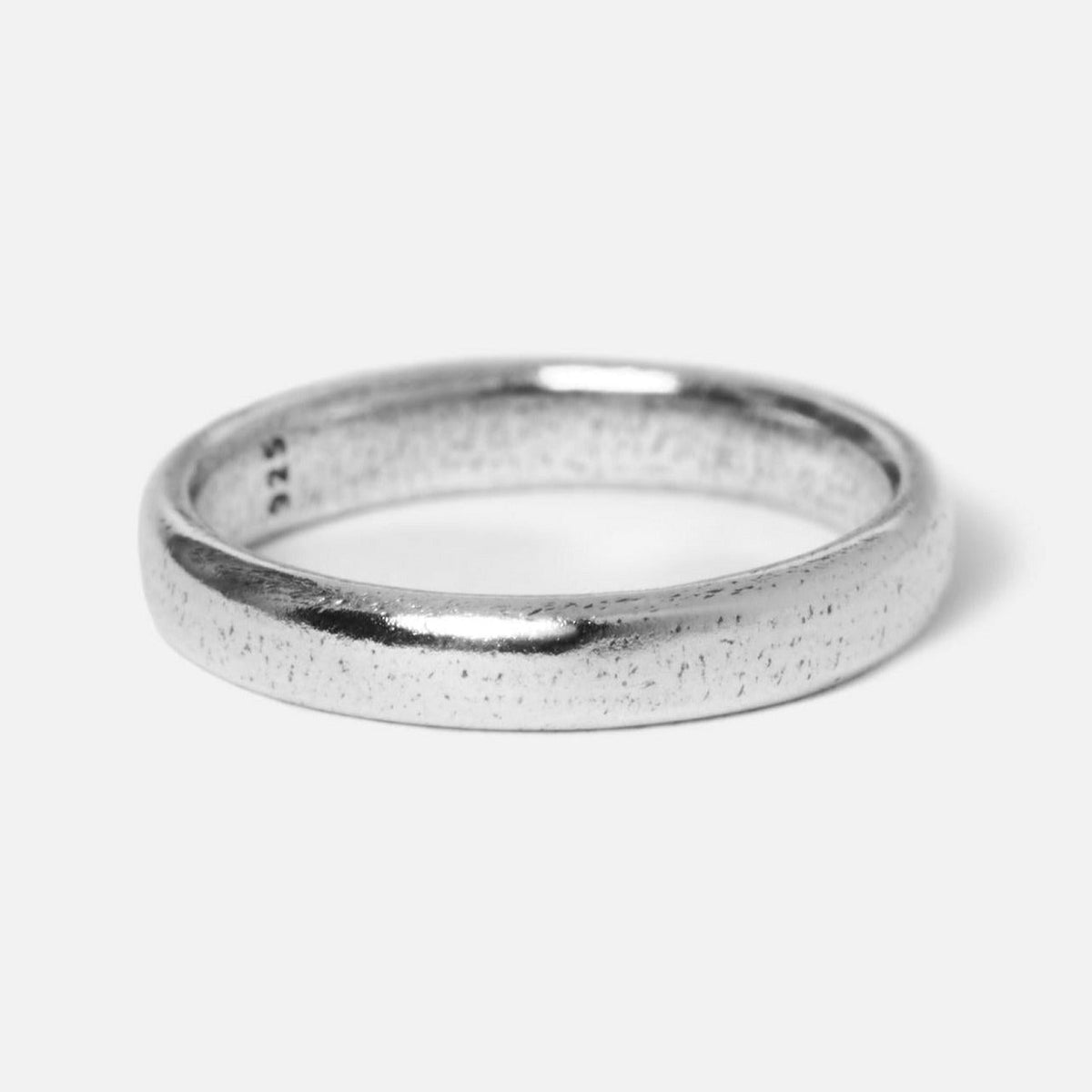 A detailed product shot of a single Billie Jo Stacker Ring in sterling silver, showcasing its rustic, textured finish and minimalist design against a clean white background.