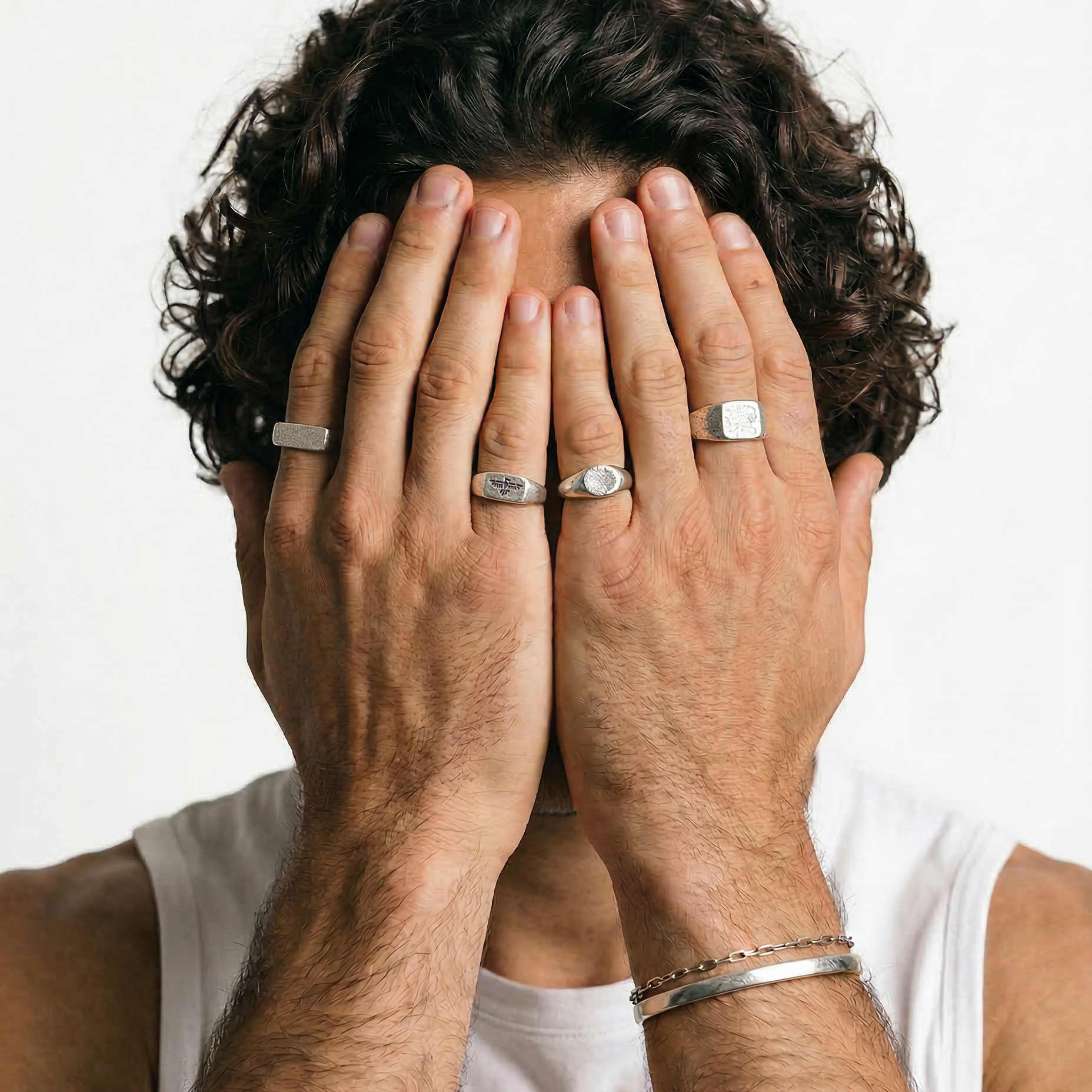 Mens rings stacked on male hand, Billie Jo sterling silver rings styled for everyday wear on the Gold Coast