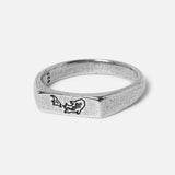 Studio image of silver ring on glossy white background v2