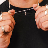 Studio portrait of Billie Jo jewelry model wearing layered necklaces