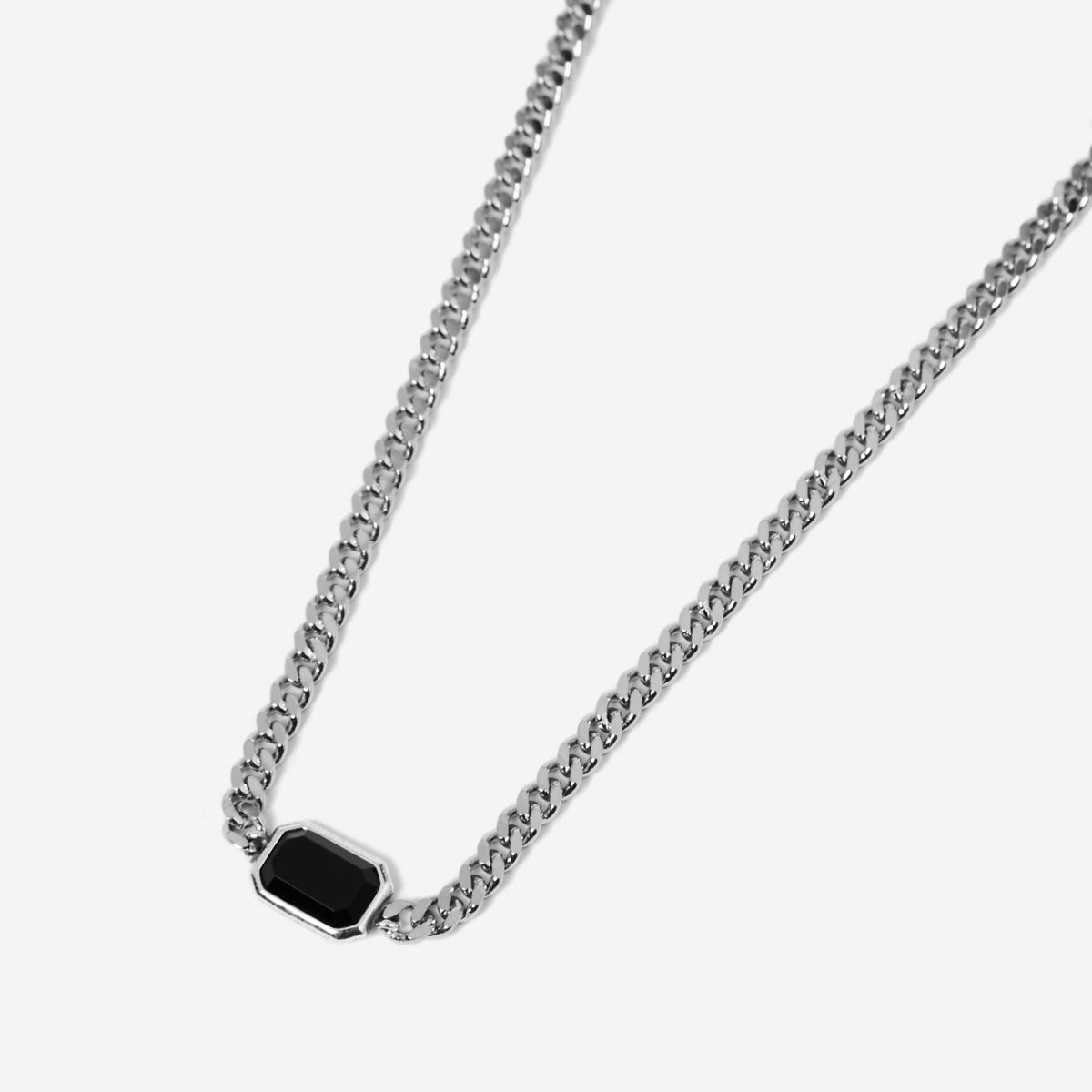 A sterling silver men's Eclipse necklace from Australian jewellery brand Billie Jo, featuring a black onyx stone on a classic curb chain.