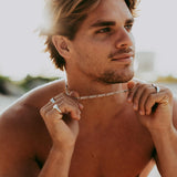 Close-up of pendant necklace with engraved detail