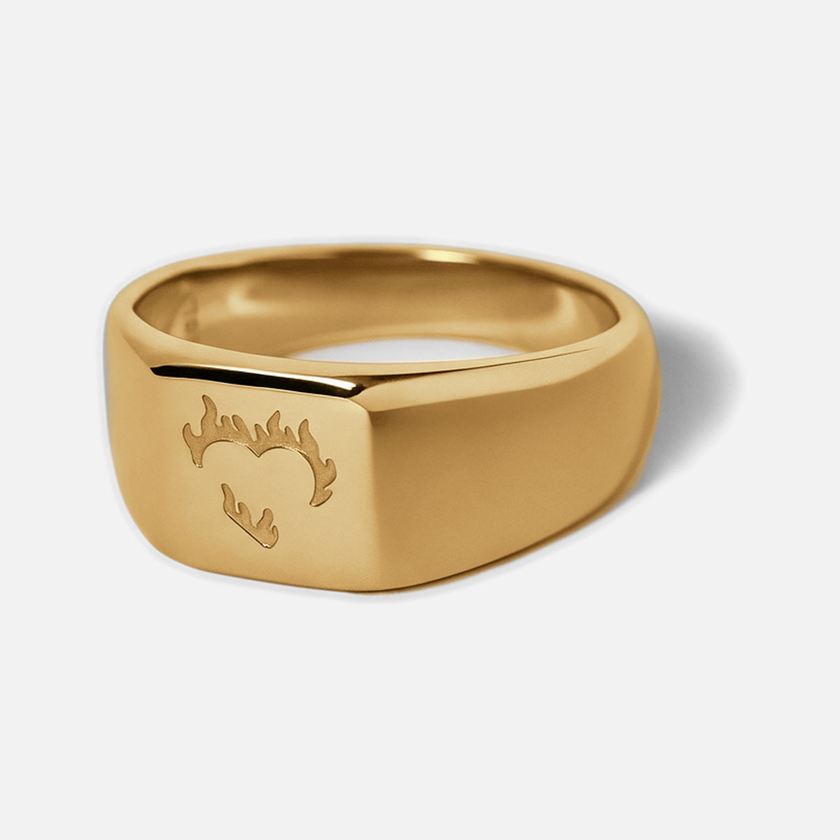 Men's Gold Ember Ring in 18k gold infused stainless steel, angled view of the flaming heart on the square face
