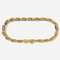 Gold chain bracelet on a light gray background