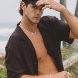 Model wearing Billie Jo rings paired with layered bracelets – contemporary style close-up.