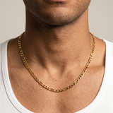 A gold stainless steel slim Figaro chain necklace from Australian jewellery brand Billie Jo, worn by a male model, a waterproof sweat proof everyday necklace and the perfect gift for him.
