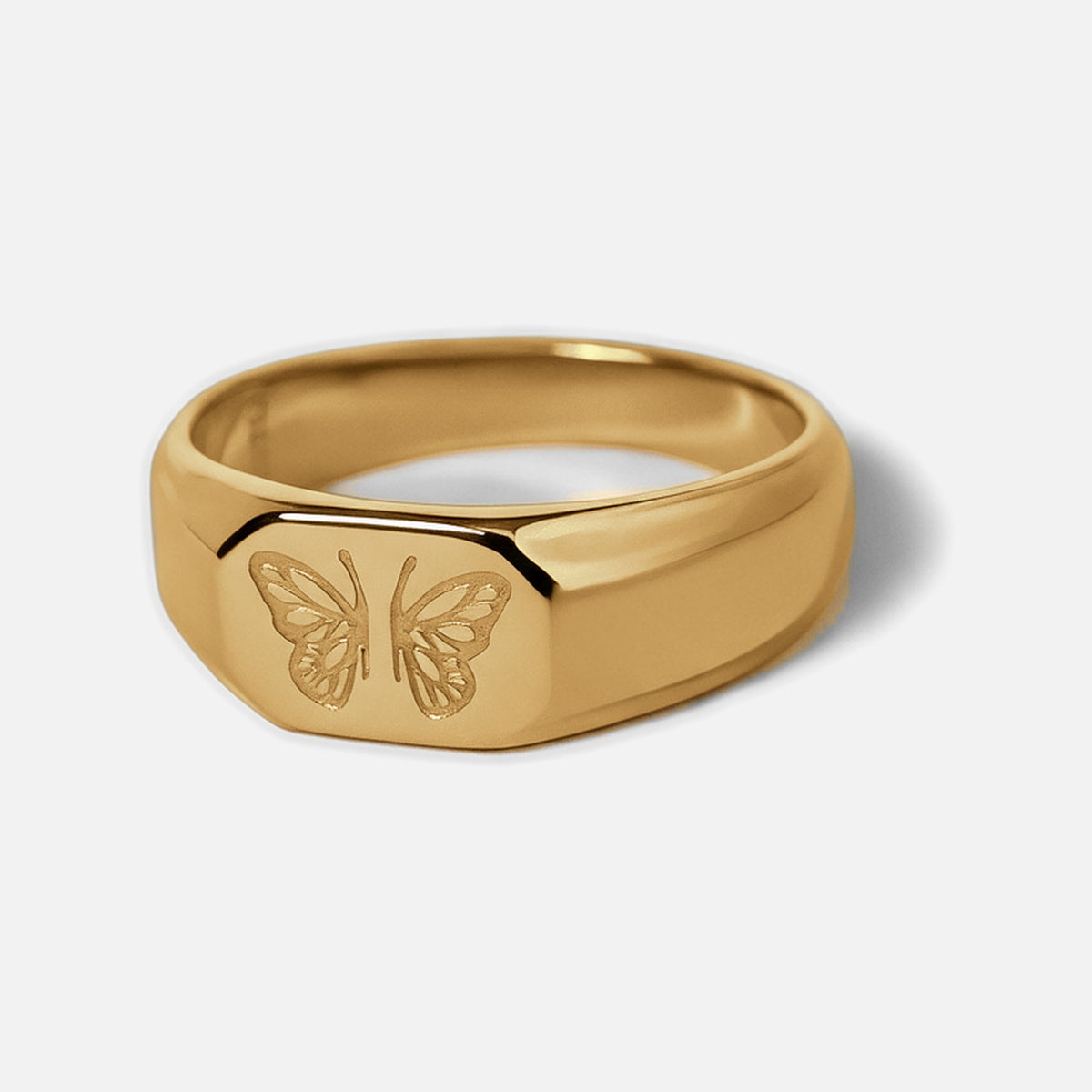 Men's Gold Revival Ring in 18k gold infused stainless steel, front angle showing the engraved butterfly, white background