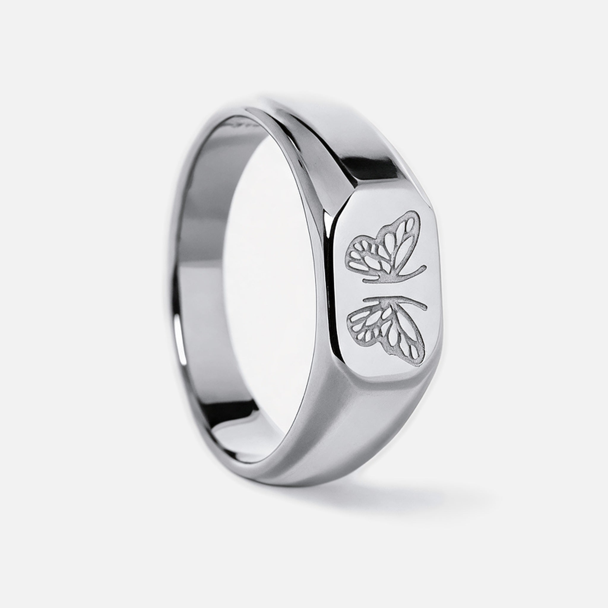 Men's Revival Ring in 316L stainless steel, silver finish, upright side view of the butterfly face, white background