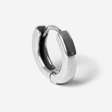 Flat lay of round earrings on white background