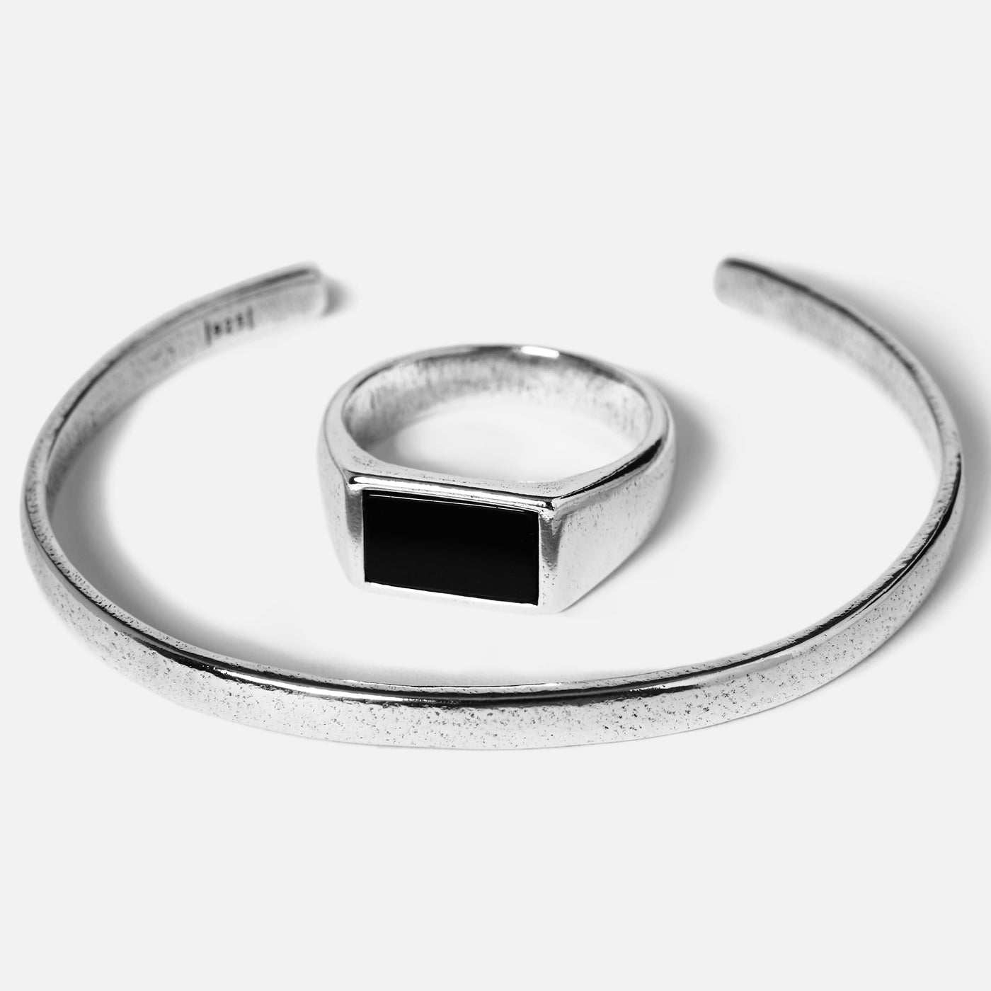 The Billie Jo Drifter & Onyx set for men. A sterling silver cuff bracelet and a matching ring with a rectangular black onyx stone.