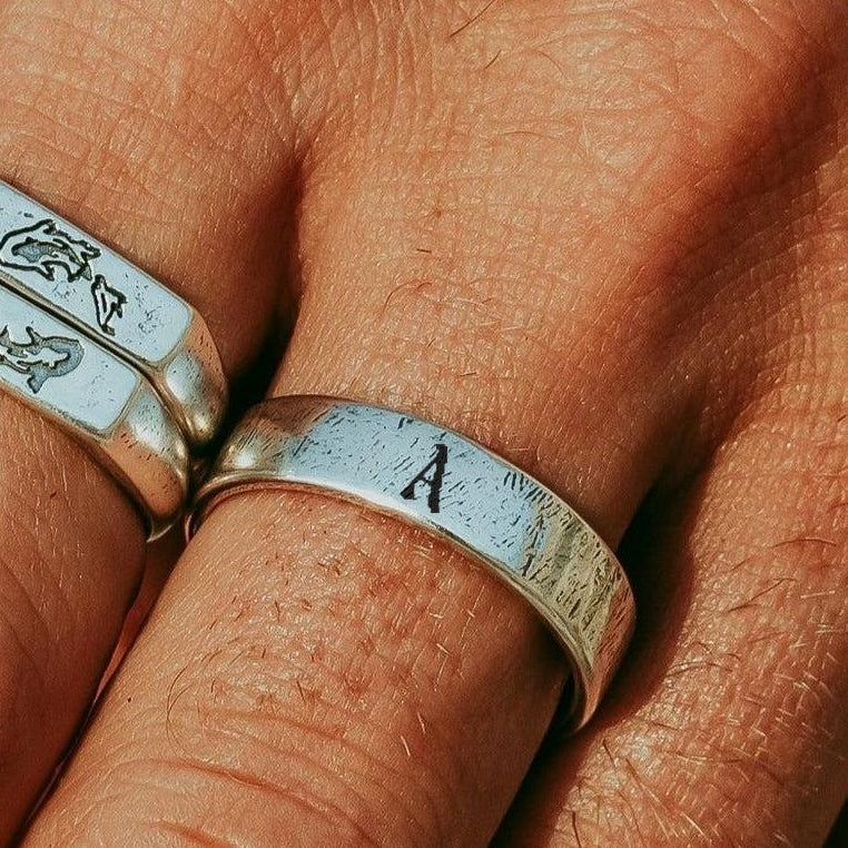 Initial Serenity Ring with the letter A, worn on a man's hand