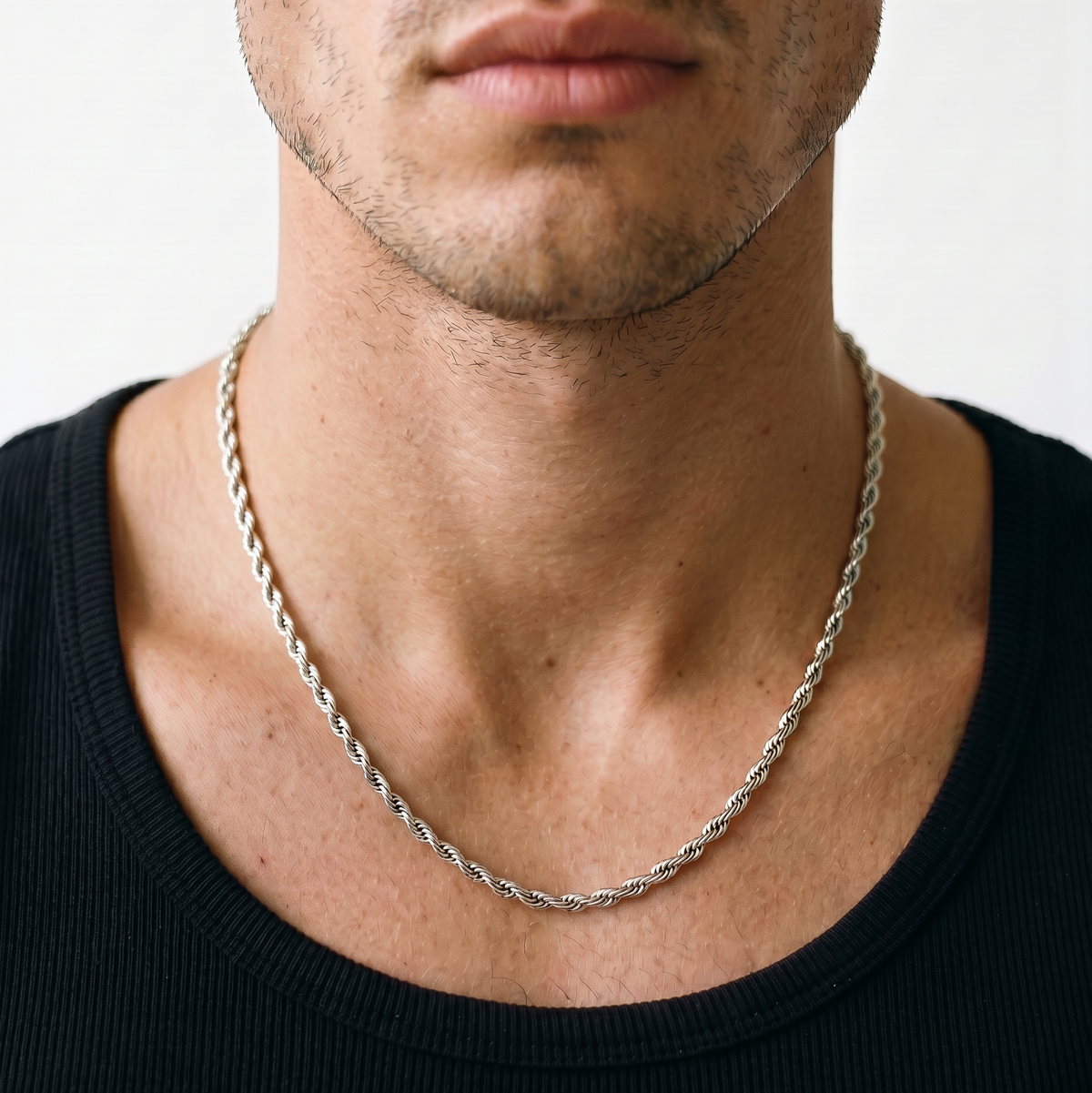 A silver  stainless steel rope chain necklace from Australian jewellery brand Billie Jo, worn by a male model, a waterproof sweat proof everyday necklace and the perfect gift for him.