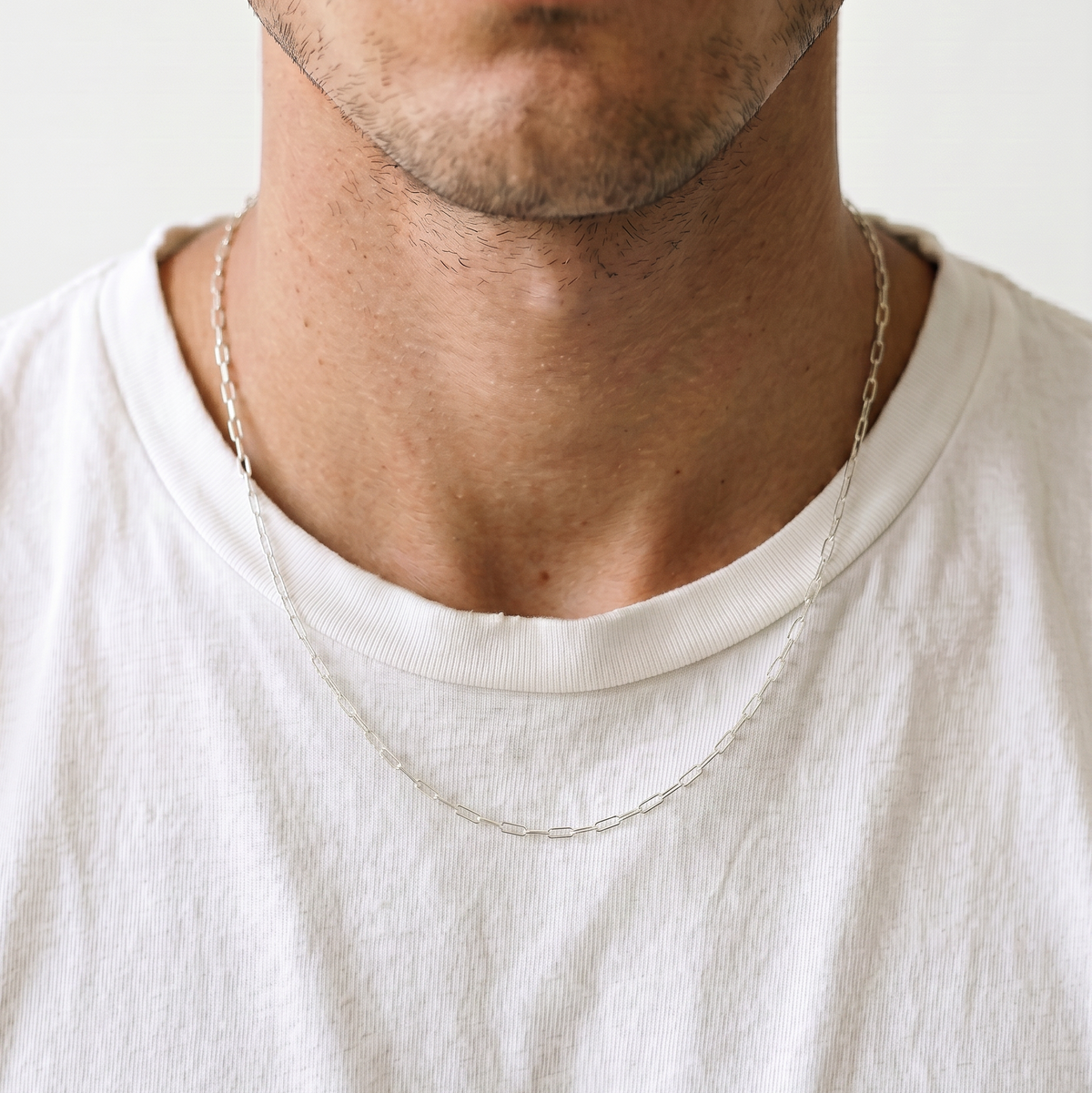 A close up of a stainless steel men's chain necklace from Australian jewellery brand Billie Jo, worn against skin showing waterproof everyday style