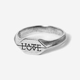 Artistic shot of Billie Jo's love-hate themed necklace