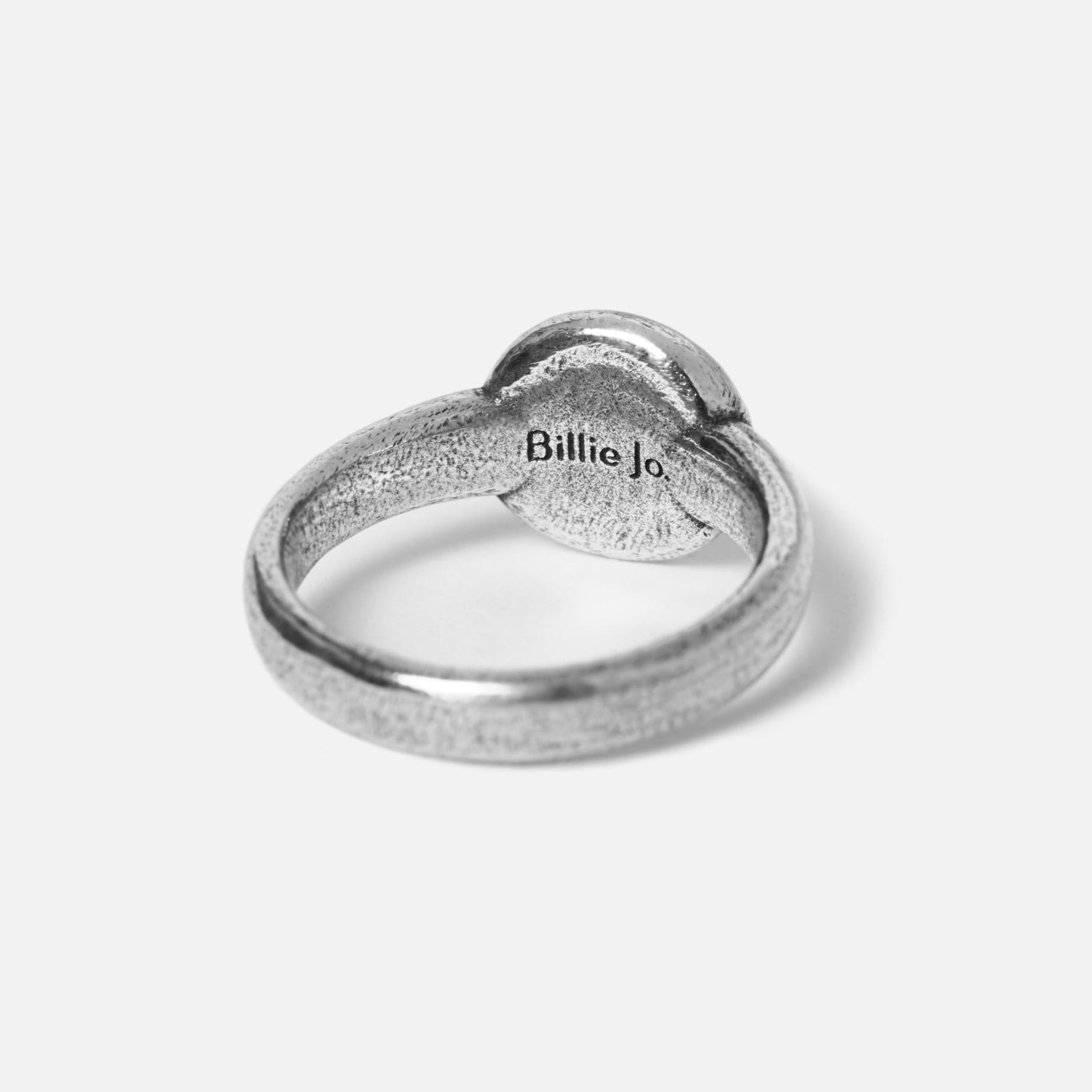 A close-up shot of the back of the Oracle ring, showing the Billie Jo brand name engraved on the inside of the band. This highlights the brand\s attention to detail and authenticity.