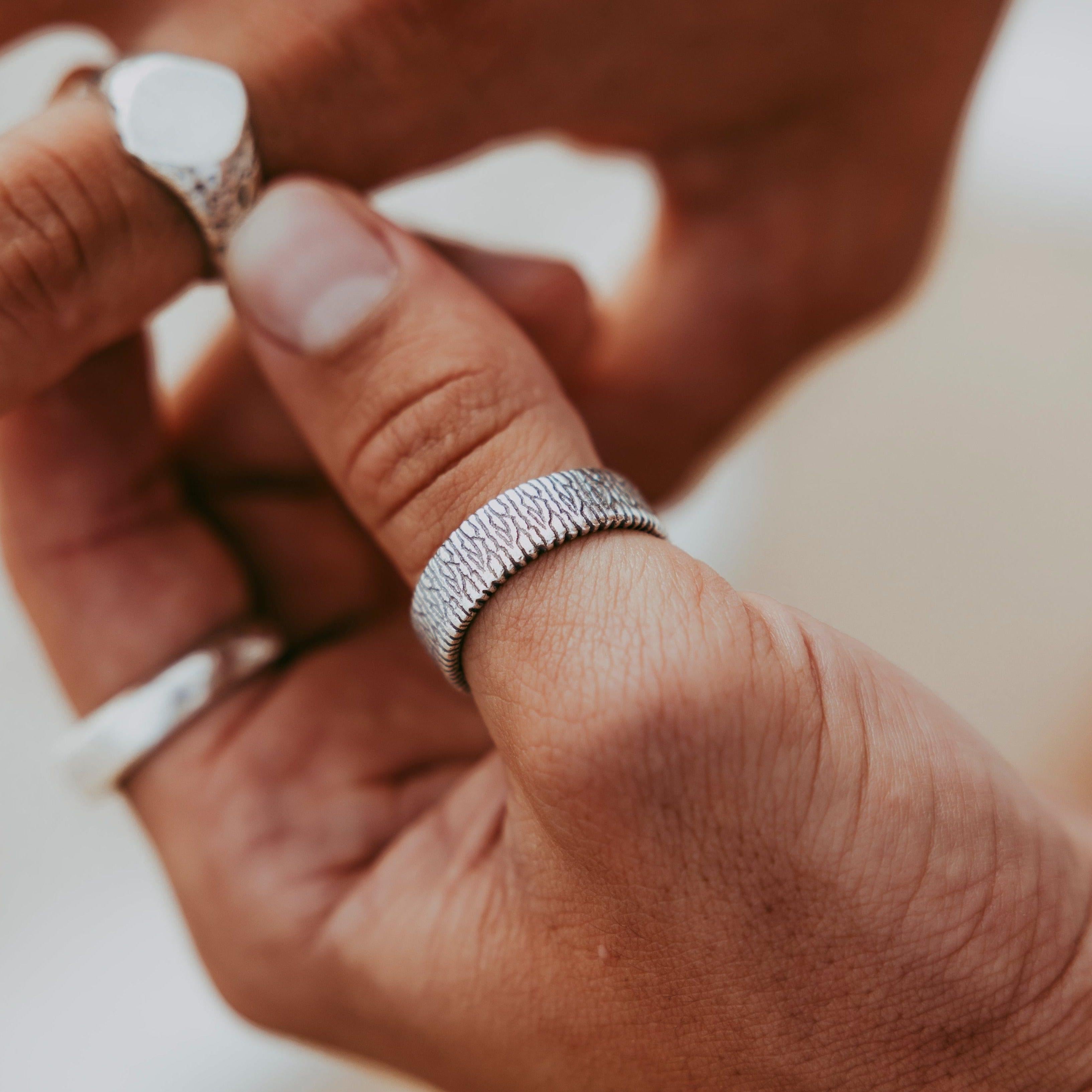 Studio-edited shot of Billie Jo rings capturing reflective shine.